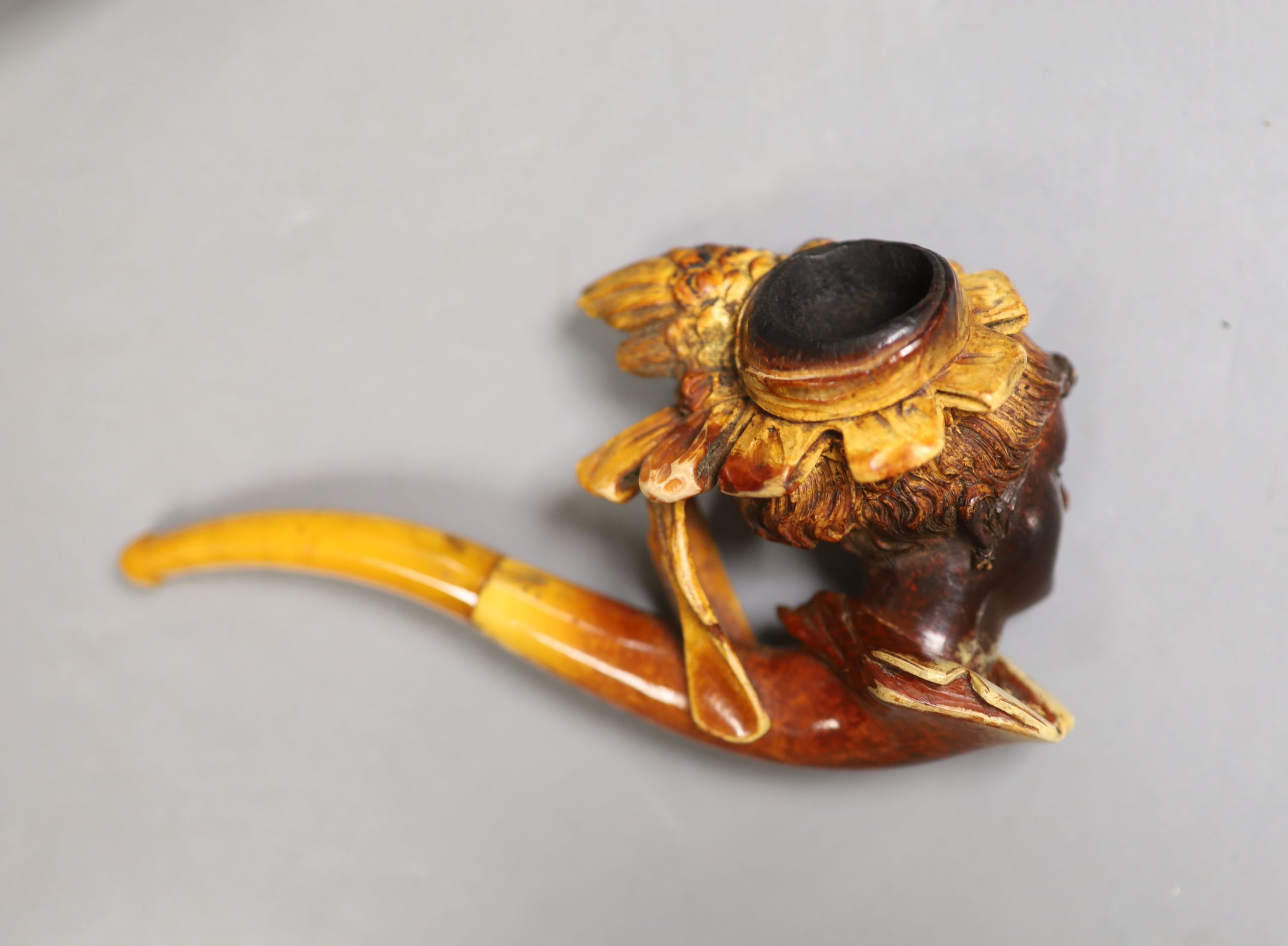 A Victorian Meerschaum pipe modelled as a lady, 13.5cm long, cased, and a Briar pipe